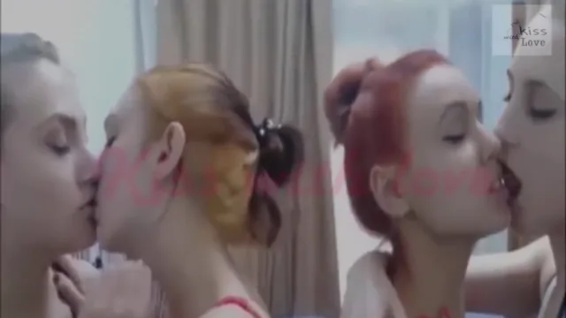 Four beautiful teens kiss and lick on video